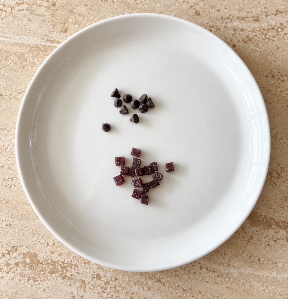 King Arthur Blueberry Jammy Bits compared with mini chocolate chips on a white plate.